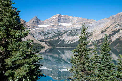 A mountain reflected on a summer day at Bow Lake at Banff National Park.