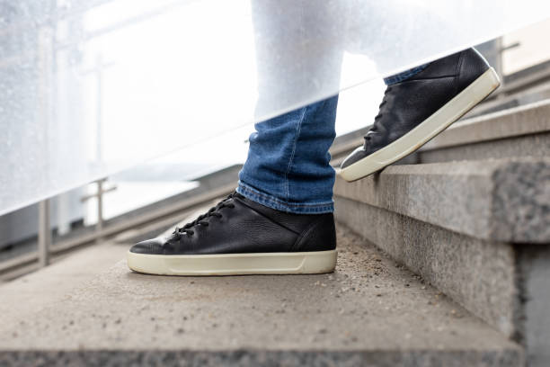 istock close-up shot of a man going down the stairs. 1482602264