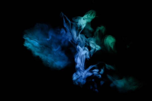 istock Blue Green smoke on a black background. Abstract image perfect for a cell phone wallpaper. 1482603901