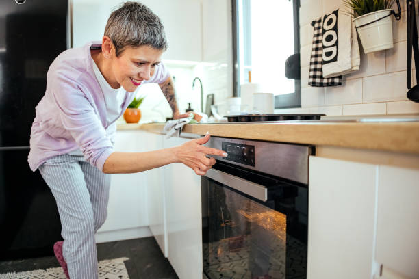 istock Woman is baking in the oven 1482604471