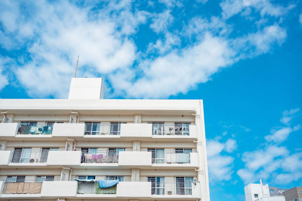 istock White Building against Blue Sky and Clouds 1482605436