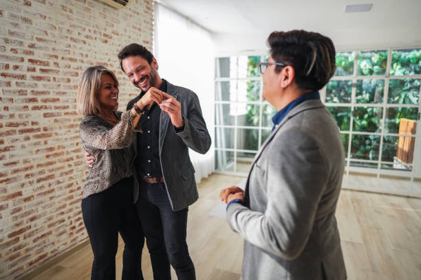 istock Couple holding new house key 1482606500