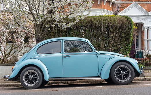 London, United Kingdom, 03.04.2023, Retro Volkswagen Beetle in blue colour parked in the street