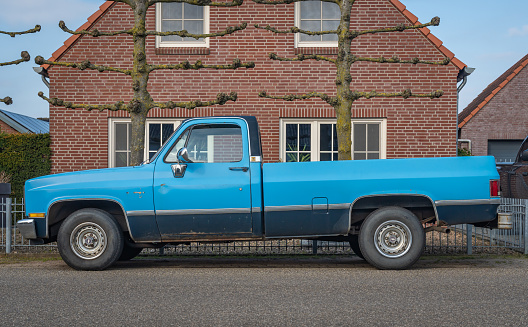 Milsbeek, The Netherlands, 08.04.2023, Side view of vintage pickup truck Chevrolet C10 from 1983