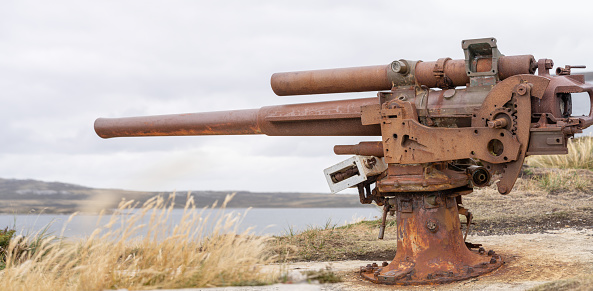 Old rusty cannon from the Falklands War in the Falkland Islands. An impressive monument to history.