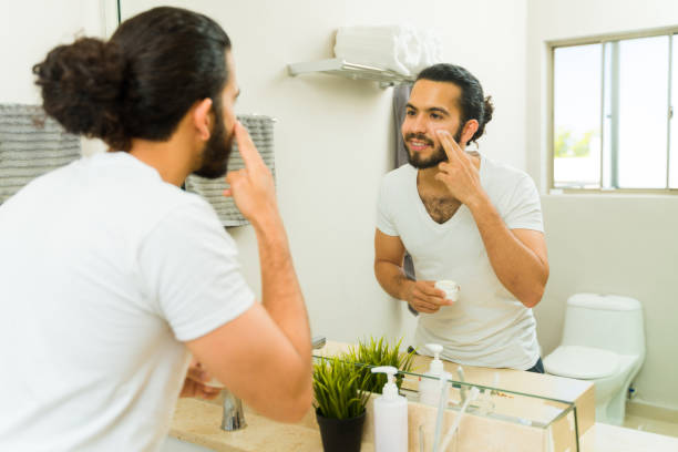 istock Hispanic young man putting face cream 1482611960