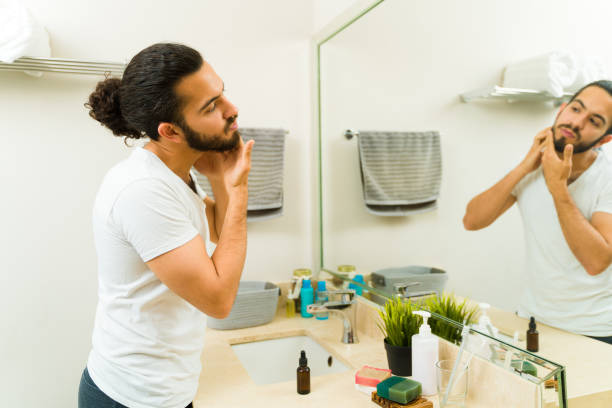 istock Profile of an hispanic young man grooming his beard 1482612049