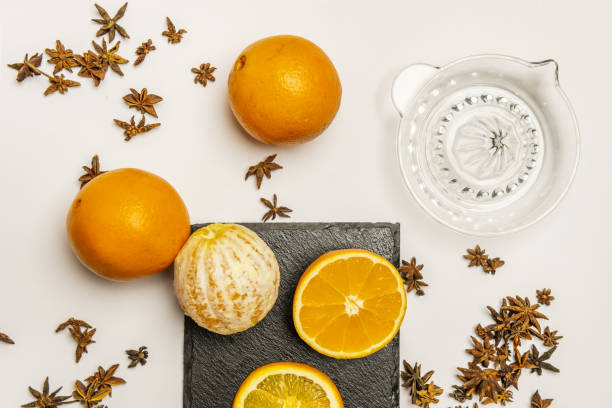 istock Some whole oranges with another peeled and another split in half along with a quantity of star anise 1482612975