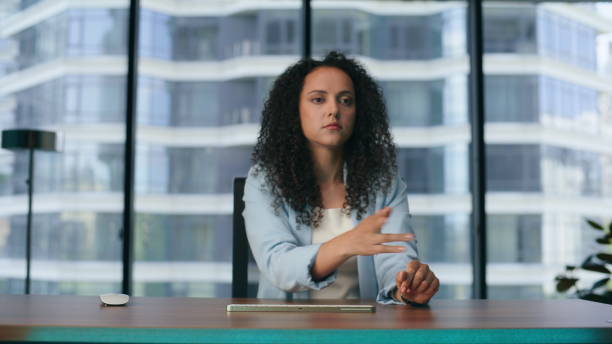 istock Futuristic businesswoman using transparent display office. Woman checking data 1482613179