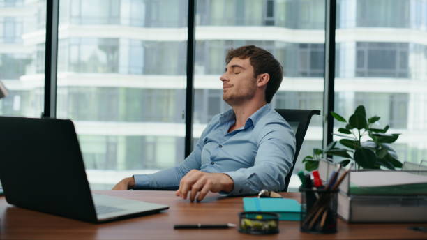 istock Overworked employee feeling exhausted on long office work at laptop close up. 1482615171