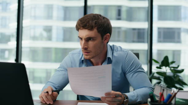 istock Angry businessman feeling stressed crumpling throwing papers in office close up. 1482615203