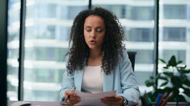 istock Woman using video chat communicating with colleagues close up. Girl working. 1482617483