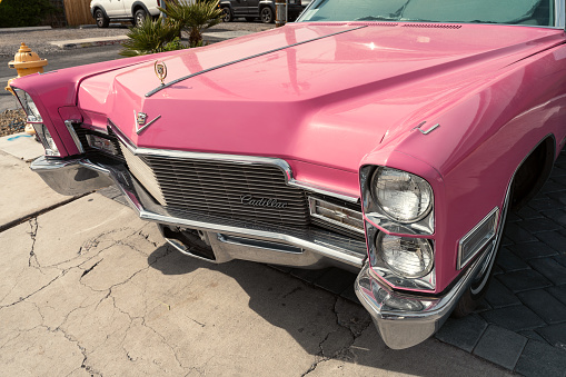 LAS VEGAS, NEVADA - April 16, 2023: Front of a classic 1950's pink Cadillac in Las Vegas.