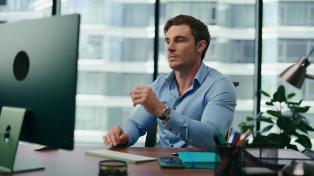 istock Portrait worried office worker sitting at desk . Tired manager working on pc. 1482618770