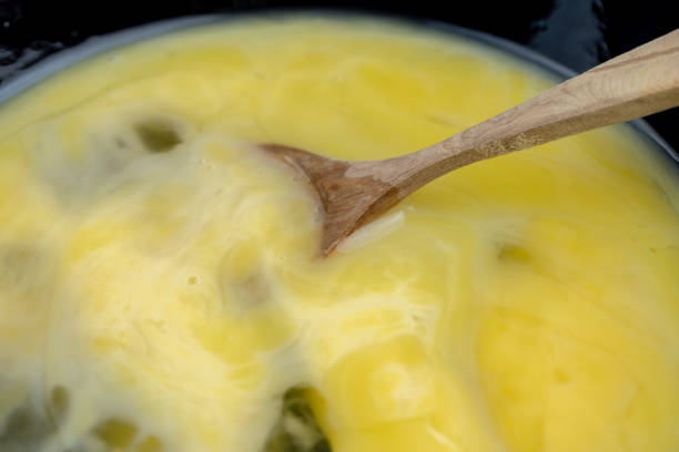 istock Homemade chicken eggs with yellow yolk broken in a bowl 1482619123
