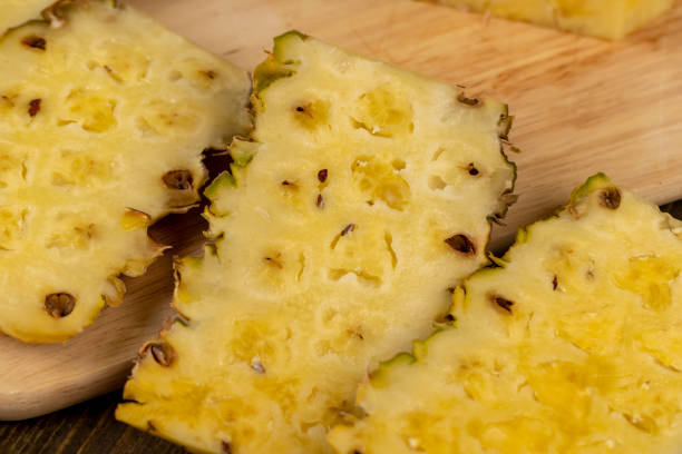 istock Sliced delicious ripe pineapple yellow, close up 1482619297