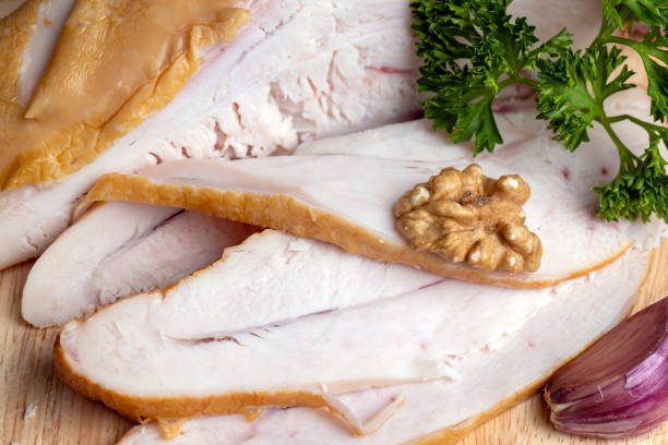 istock Smoke-smoked chicken is cut up on a board 1482619494