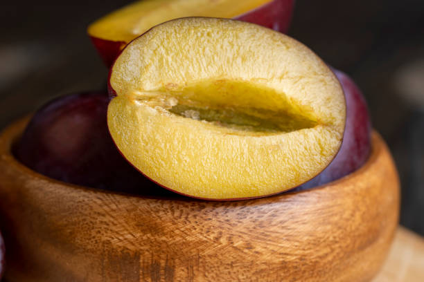 istock Ripe plums cut into pieces during cooking 1482619586