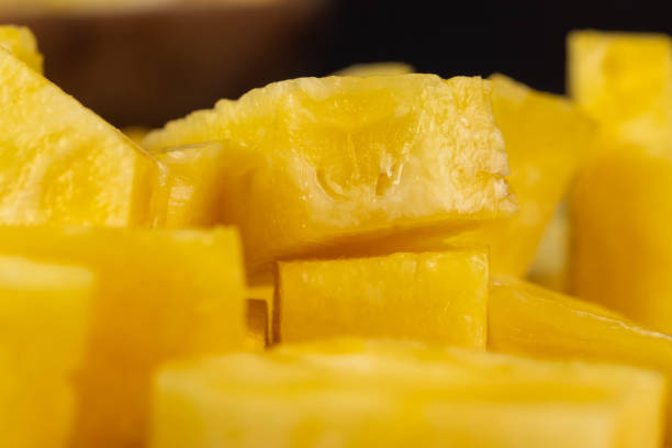 istock Sliced delicious ripe pineapple yellow, close up 1482619675
