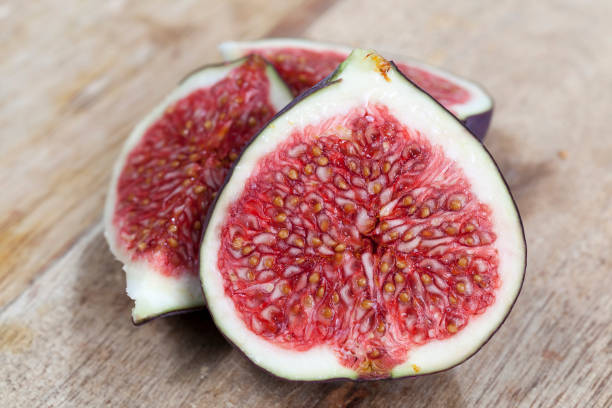 istock sliced ripe fresh purple figs, close up 1482619805