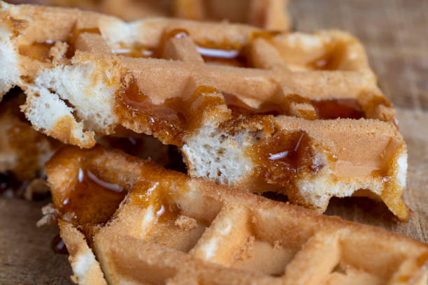 istock Soft fresh waffles with bee honey close-up 1482619838