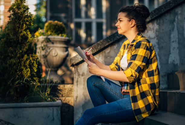 istock A young girl drawing outside 1482621143