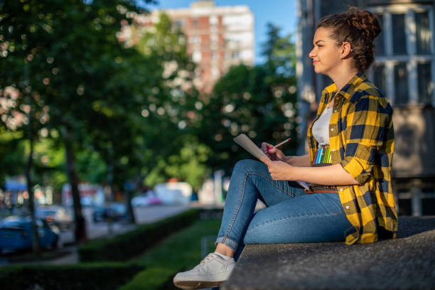 istock A young woman is drawing outside 1482621271