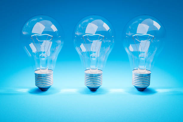 istock three retro style lightbulbs with glowing filament standing in a row on infinite colorful background; creativity design concept; 3D Illustration 1482623986