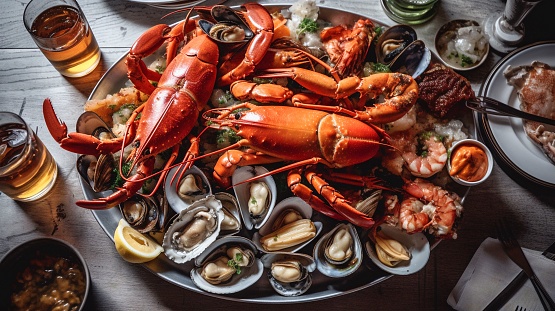 A festive table with a bounty of seafood including clams, shrimp, ready to be enjoyed