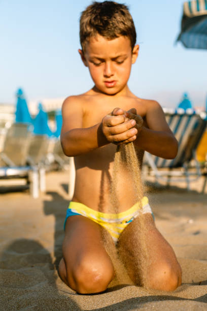 Little boy playing in the sand
