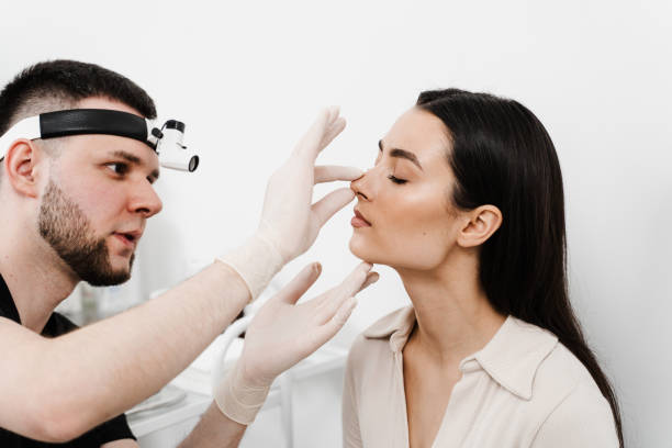 rhinoplasty is surgical procedure that involves altering shape of nose to improve appearance and enhance breathing. ent consultation before rhinoplasty plastic surgery. - nose job imagens e fotografias de stock