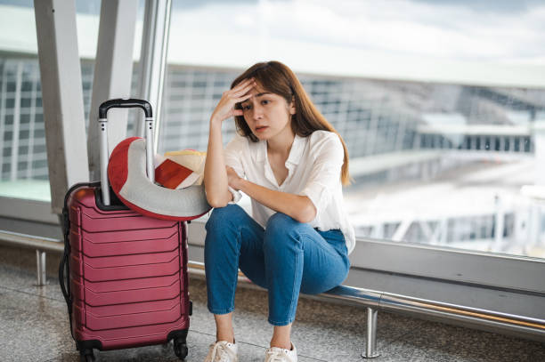 istock Grounded Dreams: An Asian Woman's Frustration Soars as Flight Gets Canceled 1482629241