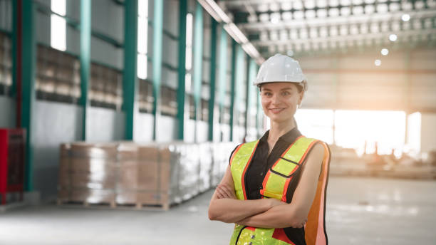 istock Portrait of engineers workers planning and talking in empty warehouse to design the arrangement of product shelves and organize strategy about new manufacturing. 1482629925