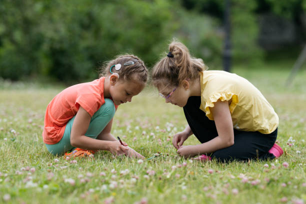 istock Two 8 years old girls playing together in park. 1482630255