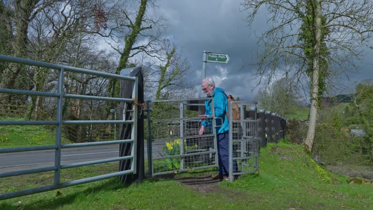 Active senior man opening a gate