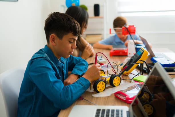 istock Latin teen boy using building a robot prototype 1482633538