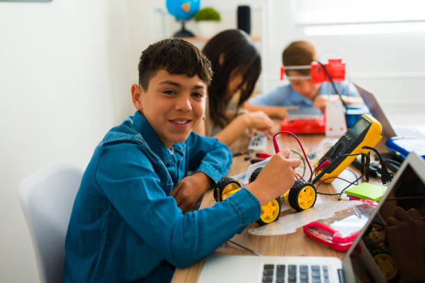istock Cheerful teen student having fun in his robotics course 1482633549