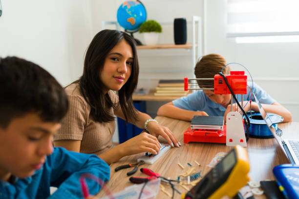 istock Group of teen students happy in their electronic robotics class 1482633561
