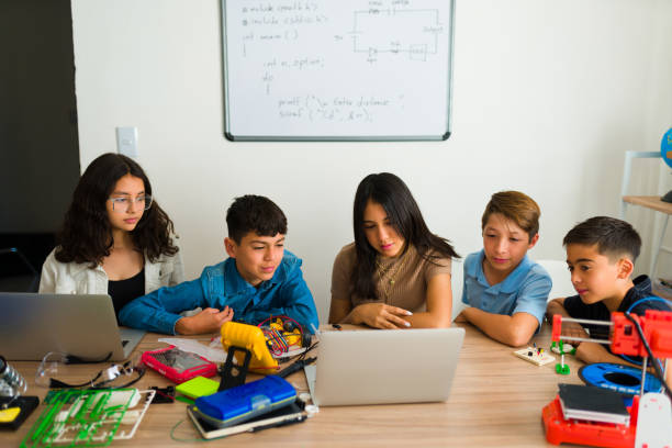 istock Smart group of teens doing a collaborative project building robots 1482634118
