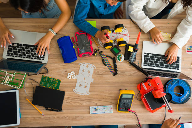 istock High angle of teen students learning about electronic and robots 1482634387