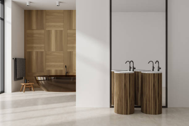 istock Stylish bathroom interior with double sink and tub, mirror and accessories 1482634735
