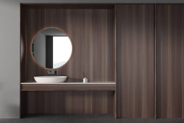 istock Dark wooden bathroom interior with sink and mirror. Empty wall 1482635633