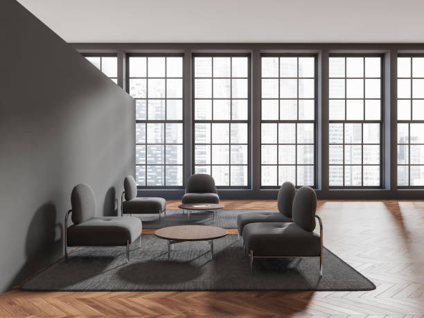istock Gray office waiting room with armchairs and windows 1482636668