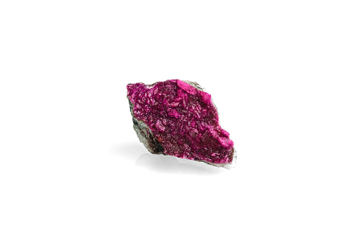 Pink cobalt-bearing dolomite. isolated on white blackground. macro detail  background. close-up Rough raw unpolished semi-precious gemstone.