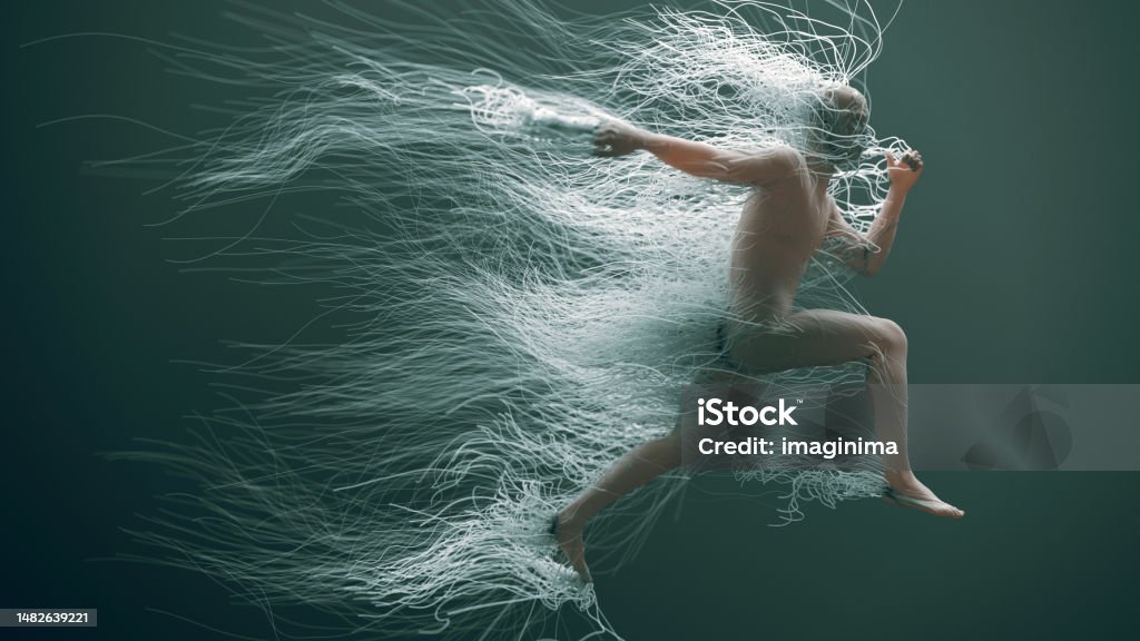 Running Man With Wires Abstract image of a man suspended in midair, locked in a running position, amidst a pale green, underwater-like environment. 
Numerous wires emerge from his form, drifting weightlessly alongside him. Artificial Intelligence Stock Photo