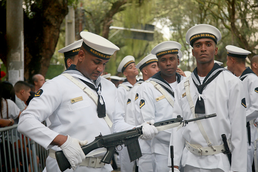 Katwa WB India - January 26, 2020 : Taken this picture in the town of Katwa in state of West Bengal on Republic Day Morning. In the picture NCC cadets saluting to District Magistrate who hoisted the Indian Flag on school ground. In background are spectators witnessing the flag hoisting sitting on the top of the school building.