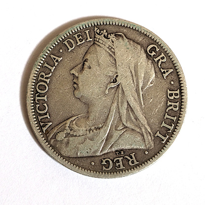 A Silver Half Crown Coin Close Up on White Bckground