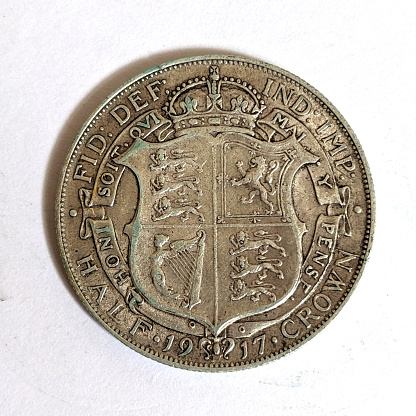 A Silver Half Crown Coin Close Up on White Bckground