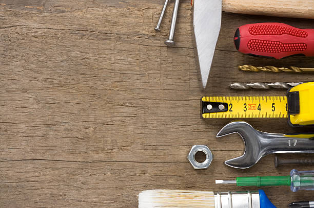 istock set of tools on wood background 148264085
