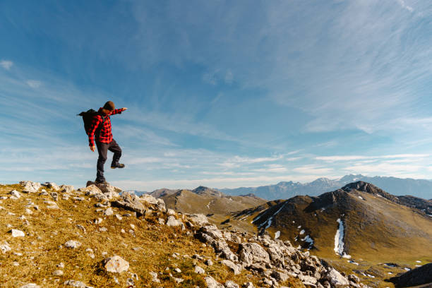 istock man hiking alone in the mountains 1482643234